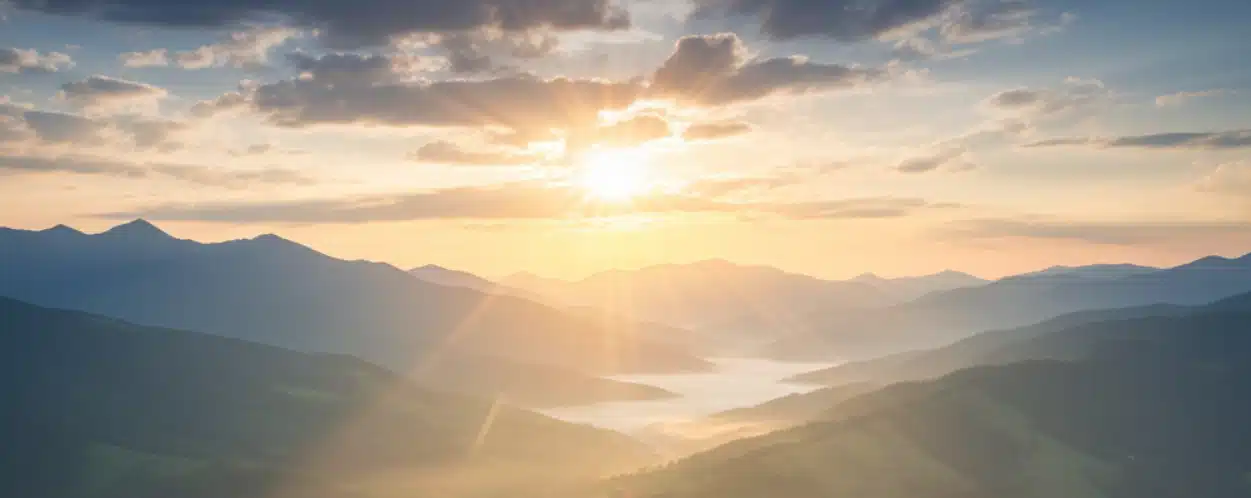 Sunrise over misty mountain landscape