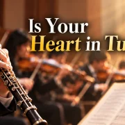 An oboe player performing with an orchestra, illustrating how we should align our hearts with God's Word.